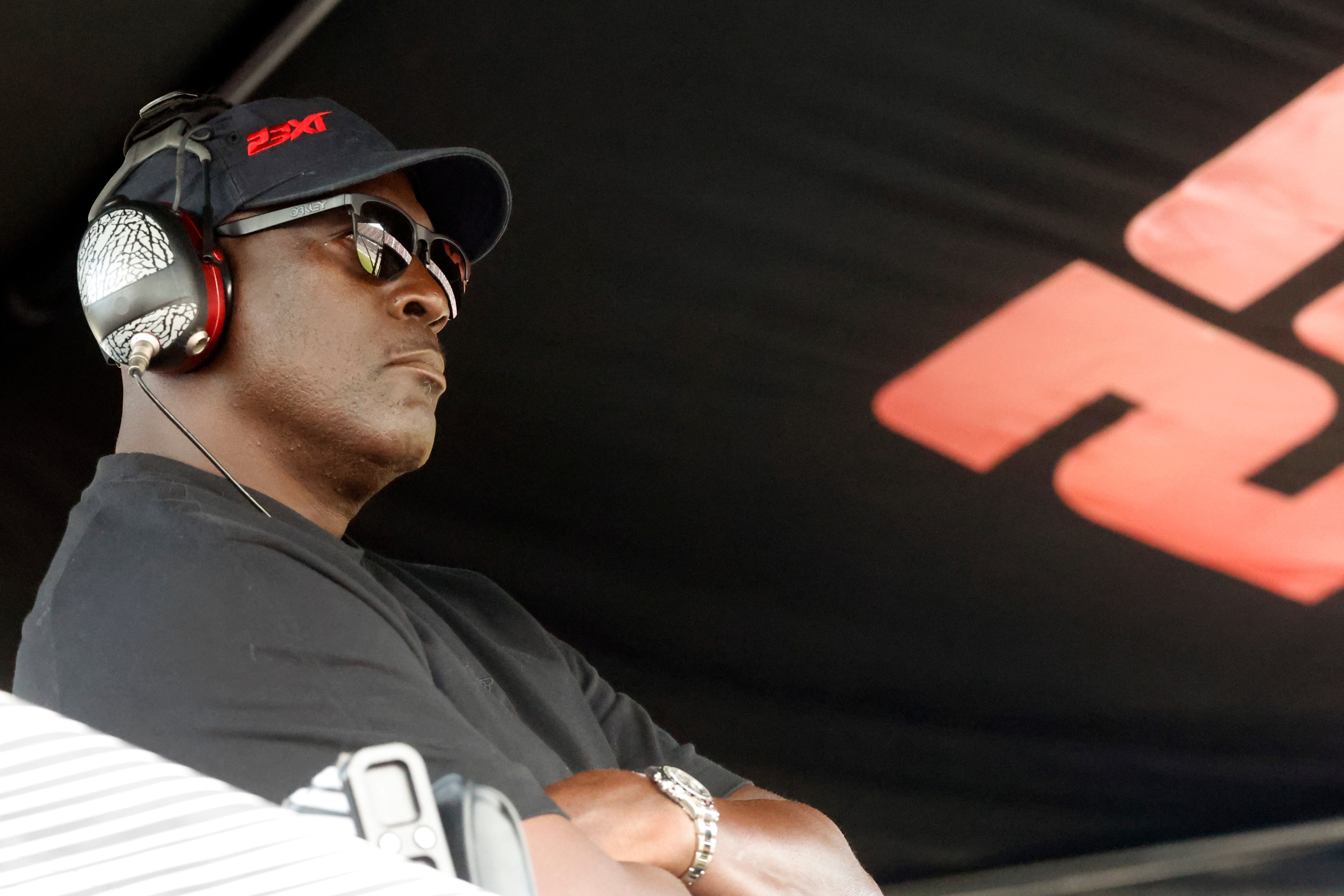 Michael Jordan, co-owner of 23XI Racing, sits in his pit box during a NASCAR Cup Series auto race at Talladega Superspeedway, Sunday, Oct. 6, 2024, in Talladega, Ala.